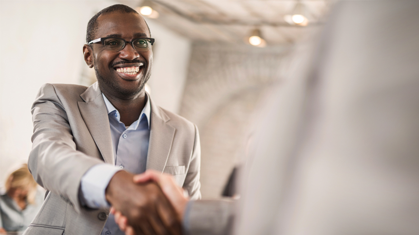 job seeker shaking hands after a job offer