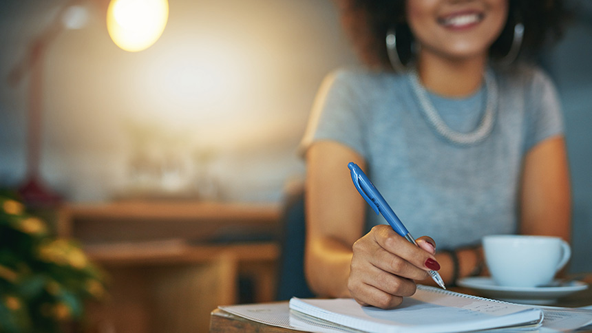 Woman ghostwriting at her desk